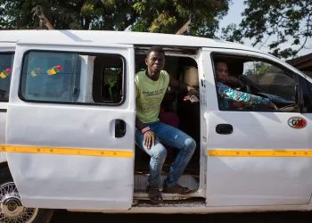 A consumer rides in a trotro to the Medina Market. Trotros are the most popular form of transportation in Ghana allowing consumers to access produce from markets.