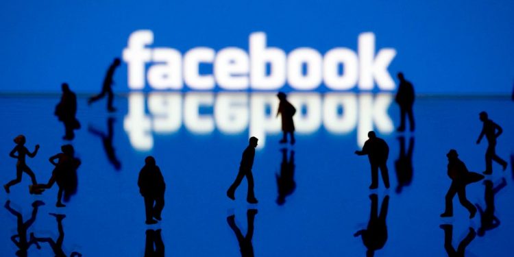 Picture taken on May 12, 2012 in Paris shows an illustration made with figurines set up in front of Facebook's homepage. Facebook, already assured of becoming one of the most valuable US firms when it goes public later this month, now must convince investors in the next two weeks that it is worth all the hype. Top executives at the world's leading social network have kicked off their all-important road show on Wall Street -- an intense marketing drive ahead of the company's expected trading launch on the tech-heavy Nasdaq on May 18.  AFP PHOTO/JOEL SAGET (Photo by Joël SAGET / AFP)        (Photo credit should read JOEL SAGET/AFP/Getty Images)