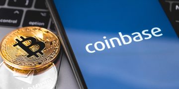 bitcoin, ethereum and smartphone with Coinbase logo on the screen. Coinbase is a digital currency exchange. Moscow, Russia - February 13, 2019