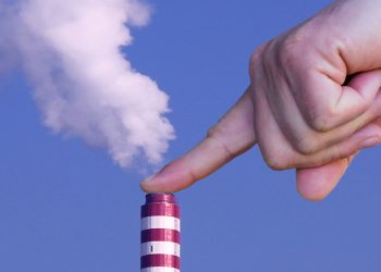 Man with hand making stop to environmental pollution