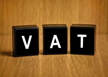 VAT or value added tax text on black block