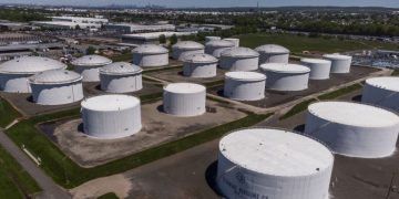 Storage tanks at a Colonial Pipeline Inc. facility in Avenel, New Jersey, U.S., on Wednesday, May 12, 2021. Motorists across a broad swath of the U.S. East Coast and South are struggling to find gasoline and diesel as filling stations run dry amid the unprecedented pipeline disruption caused by a criminal hack.