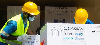 On Friday 26 February 2021, a shipment of COVAX COVID-19 vaccines are offloaded at a UNICEF -supported warehouse in Abidjan. Cote d’Ivoire received 504,000 COVID-19 vaccine doses from the COVAX Facility at the airport in Abidjan.  The vaccines and other equipment are being transported across the world by UNICEF as part of the efforts by the COVAX Facility to ensure equitable access to COVID-19 vaccines. COVAX is co-led by Gavi, the Vaccine Alliance, the World Health Organization (WHO) and the Coalition for Epidemic Preparedness Innovations (CEPI), with UNICEF leading on procurement and delivery of vaccines.  It is the only global initiative that is working with governments and manufacturers to ensure COVID-19 vaccines are available worldwide to both higher-income and lower-income countries.---The COVAX initiative shipped 504,000 doses of the AstraZeneca/Oxford vaccine, licensed by the Serum Institute of India, to India, and 505,000 syringes to Abidjan, on 26 February 2021. This marks the second batch that has been shipped and delivered to Africa by the COVAX Facility in an unprecedented effort to provide at least 2 billion doses of COVID-19 vaccine by the end of 2021.  The vaccine doses were received at Abidjan International Airport by Côte d'Ivoire’s Minister of Health and Public Hygiene, Dr Eugène Aka Aouélé, accompanied by members of the COVAX Facility – the Vaccine Alliance (Gavi), the Coalition for Epidemic Preparedness Innovations (CEPI), the United Nations Children’s Fund (UNICEF) and the World Health Organization (WHO) – in addition to the United Nations Development System (UNDS) Resident Coordinator in Côte d'Ivoire and the ambassadors of the European Union countries, whose funding enabled manufacturing, transport and distribution of the vaccine. The vaccines transported by UNICEF came from India (Mumbai), and were transported through Dubai where a shipment of syringes from a Gavi-funded stockpile was collected from UNICEF's regional su