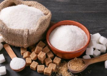 Different sugar on dark table