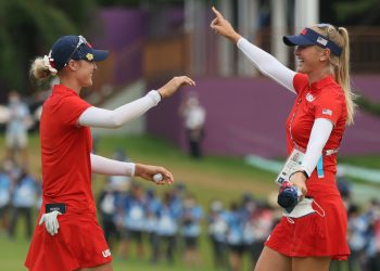 KAWAGOE, JAPAN - AUGUST 07: (L-R) Nelly Korda of Team United States celebrates with her sister Jessica Korda of Team United States after Nelly secured the gold medal on the 18th green during the final round of the Women's Individual Stroke Play on day fifteen of the Tokyo 2020 Olympic Games at Kasumigaseki Country Club on August 07, 2021 in Kawagoe, Japan. (Photo by Mike Ehrmann/Getty Images)