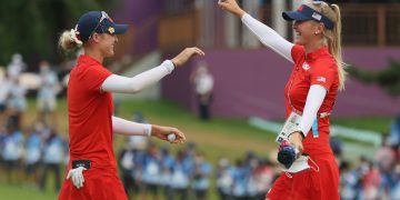 KAWAGOE, JAPAN - AUGUST 07: (L-R) Nelly Korda of Team United States celebrates with her sister Jessica Korda of Team United States after Nelly secured the gold medal on the 18th green during the final round of the Women's Individual Stroke Play on day fifteen of the Tokyo 2020 Olympic Games at Kasumigaseki Country Club on August 07, 2021 in Kawagoe, Japan. (Photo by Mike Ehrmann/Getty Images)