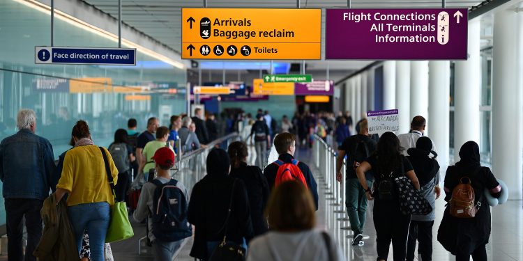 Passengers make their way towards the Baggage reclaim and flight connections in Terminal 2 having arrived at Heathrow Airport in London on July 16, 2019 (Photo by Daniel LEAL-OLIVAS / AFP)        (Photo credit should read DANIEL LEAL-OLIVAS/AFP/Getty Images)