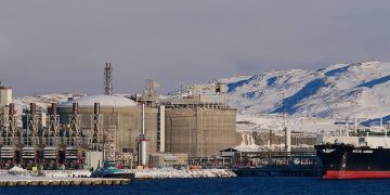 Hammerfest, Norway - 03/02/2019: Closeup view of tanker anchoring at Europe's largest liquefied natural gas (LNG) site on Melkøya island in the arctic sea in winter time.