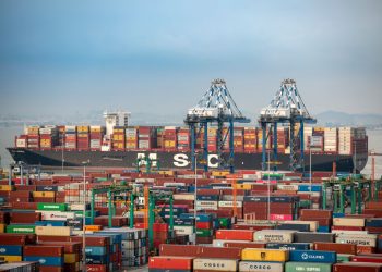 GUANGZHOU, CHINA - JUNE 08: Aerial view of shipping containers sitting stacked at Nansha Port, operated by Guangzhou Port Group Co., on June 8, 2021 in Guangzhou, Guangdong Province of China. (Photo by Qian Wenpan/Nanfang Daily/VCG via Getty Images)