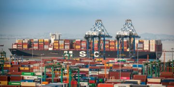 GUANGZHOU, CHINA - JUNE 08: Aerial view of shipping containers sitting stacked at Nansha Port, operated by Guangzhou Port Group Co., on June 8, 2021 in Guangzhou, Guangdong Province of China. (Photo by Qian Wenpan/Nanfang Daily/VCG via Getty Images)