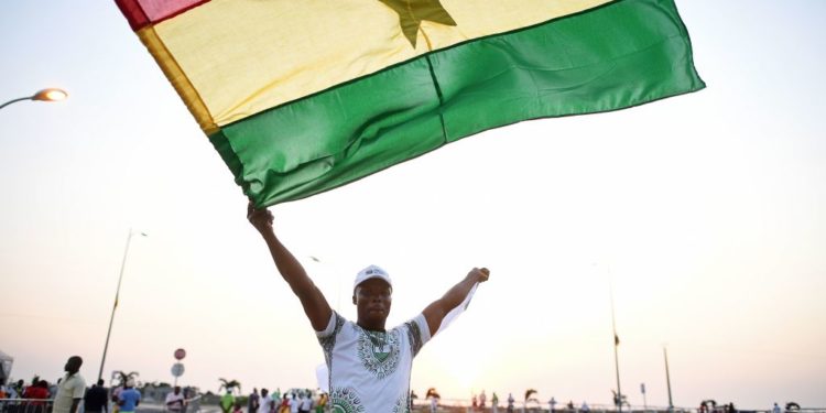 A Ghana supporter waves a Ghanaian flag as he arrives to attend the 2017 Africa Cup of Nations group D football match between Egypt and Ghana in Port-Gentil on January 25, 2017. (Photo by Justin TALLIS / AFP) (Photo by JUSTIN TALLIS/AFP via Getty Images)