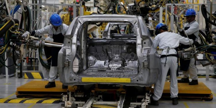 Workers are seen assembling a Mitsubishi Pajero at the Mitsubishi car factory in Bekasi, West Java province, Indonesia April 25, 2017. REUTERS/Beawiharta