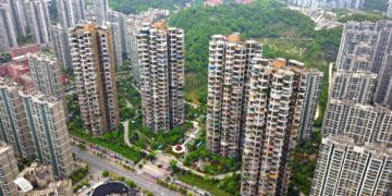 An aerial view of a strange local apartment, which seems like composed of many circles, in the city center, Guiyang city, southwest China's Guizhou province, 26 April 2020. (Photo by Stringer / Imaginechina via AFP)