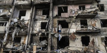 The scene after a residential building was hit by missiles in Kyiv, Ukraine, Feb. 25, 2022. While most American allies in Asia have fallen in line on reactions to the Russian invasion of Ukraine, authoritarian governments and those with weaker ties to the West have been more reluctant to act. (Lynsey Addario/The New York Times) -- NO SALES