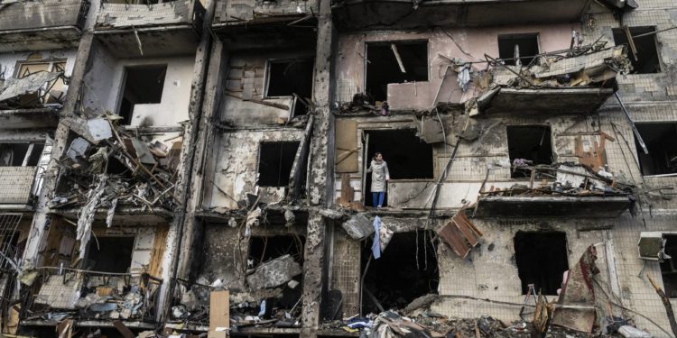 The scene after a residential building was hit by missiles in Kyiv, Ukraine, Feb. 25, 2022. While most American allies in Asia have fallen in line on reactions to the Russian invasion of Ukraine, authoritarian governments and those with weaker ties to the West have been more reluctant to act. (Lynsey Addario/The New York Times) -- NO SALES