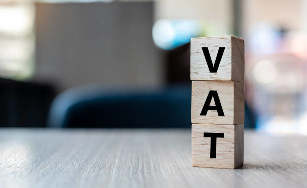 wooden cube with VAT text on table background. Financial, marketing and business concepts