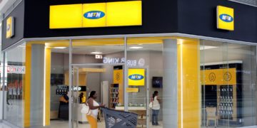 A shopper walks past an MTN shop at a mall in Johannesburg, South Africa, March 2, 2017. REUTERS/Siphiwe Sibeko