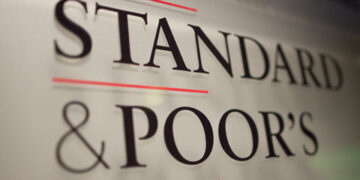 epa03028011 A sign displays the name of Standard & Poor's financial rating services in its offices in Paris, France, 08 December 2011. On 05 December, Standard & Poor's placed the EU AAA credit rating on credit watch, warning it may downgrade the euro-zone countries if a solution Europe's debt crisis during was not agreed on.  EPA/IAN LANGSDON