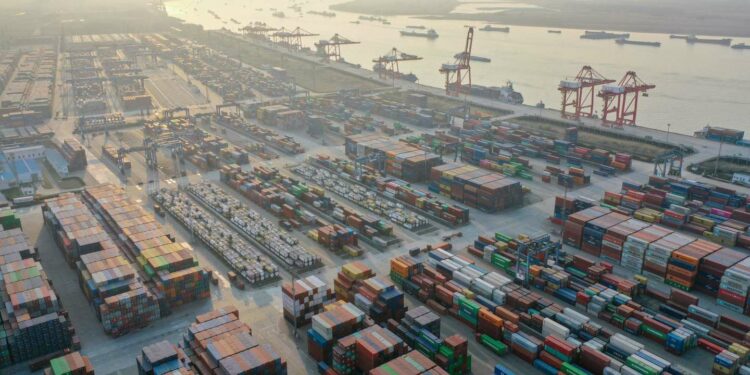 This aerial photo taken on January 3, 2023 shows cranes and shipping containers at Nanjing port in China's eastern Jiangsu province. China OUT
(Photo by AFP)