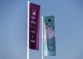 Sponsor logos on display on a flag outside Lusail Stadium in Doha, Qatar, on Saturday, Nov. 19, 2022. Embattled FIFA President Gianni Infantino pushed back against criticism of the Qatar World Cup a day before the tournament begins following years of planning. Photographer: Christopher Pike/Bloomberg