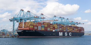 Algeciras, Cadiz Spain; 20 January 2022: A MSC freighter is docked on harbor, Container ship at industrial port in import export business logistic and transportation of international