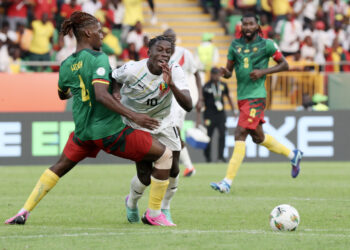 Moriba Kourouma of Guinea  fouled by Christopher Maurice Wooh of Cameroon during the 2023 Africa Cup of Nations match between Cameroon and Guinea at Charles Konan Banny Stadium in Yamoussoukro, Cote dlvoire on 15 January 2024 ©Gavin Barker/BackpagePix