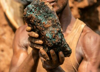 Dela wa Monga, an artisanal miner, holds a cobalt stone at the Shabara artisanal mine near Kolwezi on October 12, 2022. - Some 20,000 people work at Shabara, in shifts of 5,000 at a time.
Congo produced 72 percent of the worlds cobalt last year, according to Darton Commodities. And demand for the metal is exploding due to its use in the rechargeable batteries that power mobile phones and electric cars.
But the countrys poorly regulated artisanal mines, which produce a small but not-negligeable percentage of its total output, have tarnished the image of Congolese cobalt. (Photo by Junior KANNAH / AFP) (Photo by JUNIOR KANNAH/AFP via Getty Images)