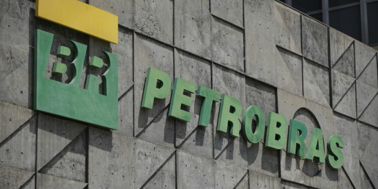 RIO DE JANEIRO, BRAZIL - OCTOBER 15: Petrobras logo outside headquarters building in downtown Rio de Janeiro on October 15, 2021 in Rio de Janeiro, Brazil. President Jair Bolsonaro said on a radio interview on Thursday that he analyses to privatize state-controlled oil company Petrobras that is under pressure to lower fuel prices. On Wednesday, Economy Minister Paulo Guedes had suggested the government could sell part of its controlling stakes within a decade to fund welfare programs. (Photo by Wagner Meier/Getty Images)