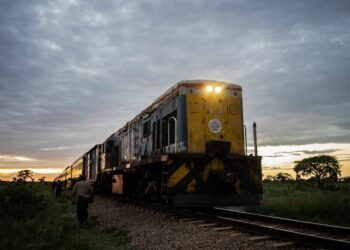 A commuter train known as the 'Freedom Train' approaches a station early morning on January 29, 2019 in Cowdray Park township, in Bulawayo, Zimbabwe. - Zimbabwe's only commuter train is cheap and reliable -- two qualities that its passengers cherish in a downwards-spiralling economy. (Photo by Zinyange Auntony / AFP)        (Photo credit should read ZINYANGE AUNTONY/AFP via Getty Images)