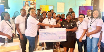 Magaret Obimpeh, Head, Affluent Clients, Stanbic Bank Ghana presenting cheque and to Mrs. Victoria Adewodah, Assistant Director of Prisons