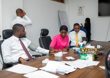 Some employees of the Banking checking their vitals at the screening centre at the Bank’s Head Office.