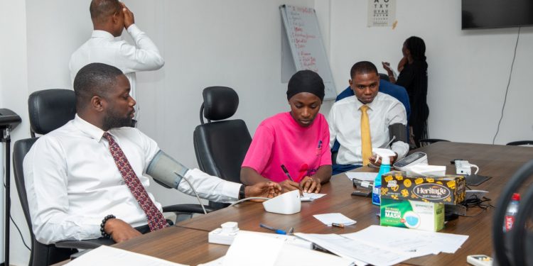 Some employees of the Banking checking their vitals at the screening centre at the Bank’s Head Office.