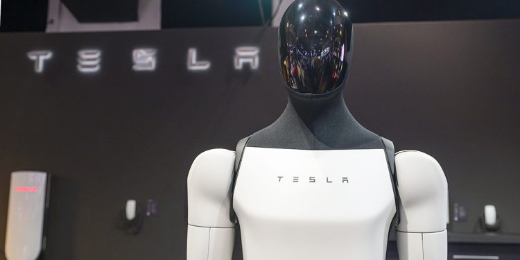 BRUSSELS, BELGIUM - JANUARY 09: Tesla Optimus, also known as Tesla Bot general-purpose robotic humanoid on display at the AutoSalon press preview on January 09, 2026 in Brussels, Belgium. The 102nd Brussels Motor Show has firmly established itself on the international calendar, featuring over 60 car brands and more than 20 motorcycle brands, and visited by over 270,000 people. (Photo by Sjoerd van der Wal/Getty Images)