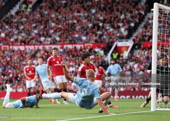 MANCHESTER, ENGLAND - SEPTEMBER 13: Erling Braut Haaland of Manchester City scores their side's first goal during the Premier League 2026/27 match between Manchester United and Manchester City at Old Trafford on September 13, 2026 in Manchester, England. (Photo by Alex Livesey - Danehouse/Getty Images)