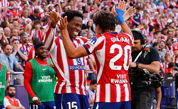 Atletico Madrid's Canadian forward #15 Jonathan David (L) celebrates scoring his team's second goal during the Spanish league football match between Club Atletico de Madrid and Real Madrid CF at the Metropolitano stadium in Madrid on September 20, 2026. (Photo by Oscar DEL POZO / AFP via Getty Images)