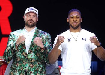 LONDON, ENGLAND - SEPTEMBER 30: Tyson Fury and Anthony Joshua pose for a photo after facing off during the announcement for the upcoming Tyson Fury vs. Anthony Joshua fight at The British Airways Arc on September 30, 2026 in London, England. The fight will stream live on Netflix on 11th December. (Photo by Richard Pelham/Getty Images for Netflix)