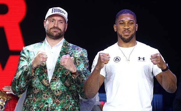 LONDON, ENGLAND - SEPTEMBER 30: Tyson Fury and Anthony Joshua pose for a photo after facing off during the announcement for the upcoming Tyson Fury vs. Anthony Joshua fight at The British Airways Arc on September 30, 2026 in London, England. The fight will stream live on Netflix on 11th December. (Photo by Richard Pelham/Getty Images for Netflix)