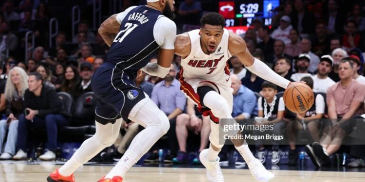 MIAMI, FLORIDA - OCTOBER 26: Giannis Antetokounmpo #7 of the Miami Heat drives against Daniel Gafford #21 of the Dallas Mavericks during the fourth quarter of the game at Kaseya Center on October 26, 2026 in Miami, Florida. NOTE TO USER: User expressly acknowledges and agrees that, by downloading and or using this photograph, User is consenting to the terms and conditions of the Getty Images License Agreement. (Photo by Megan Briggs/Getty Images)